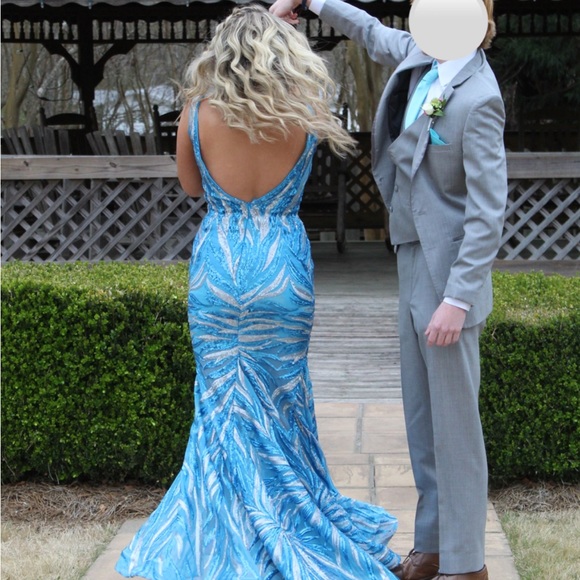 The beautiful dress is Jovani, a size 4, no alterations and has been worn once. - Picture 3 of 3